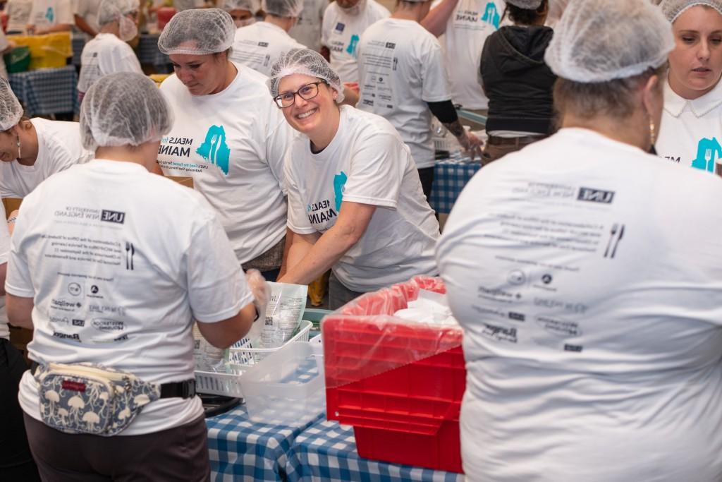U N E employees participate in the Meals for Mainers event